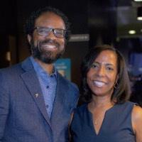 Man and woman smile together at camera